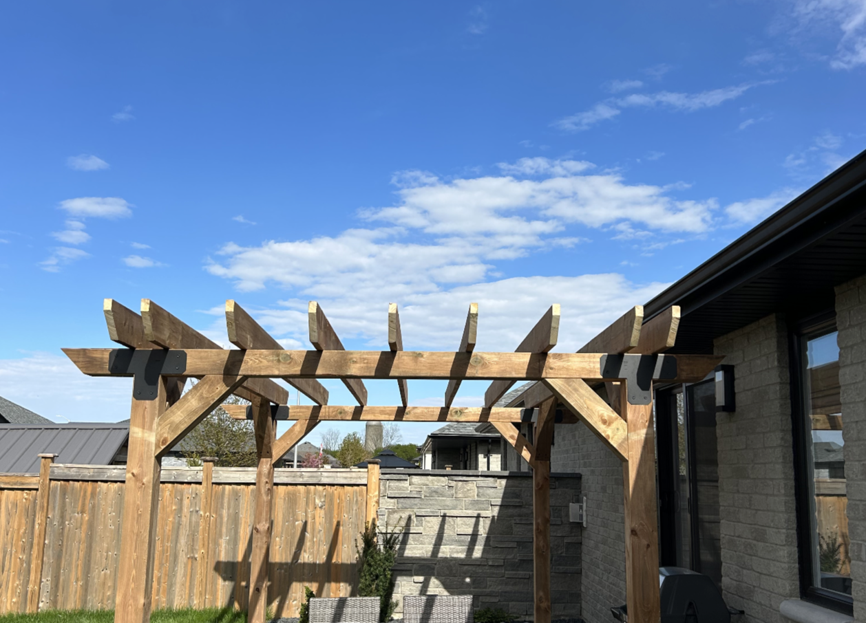 The Premium Pergola front angle showing the full pergola frame and rafters