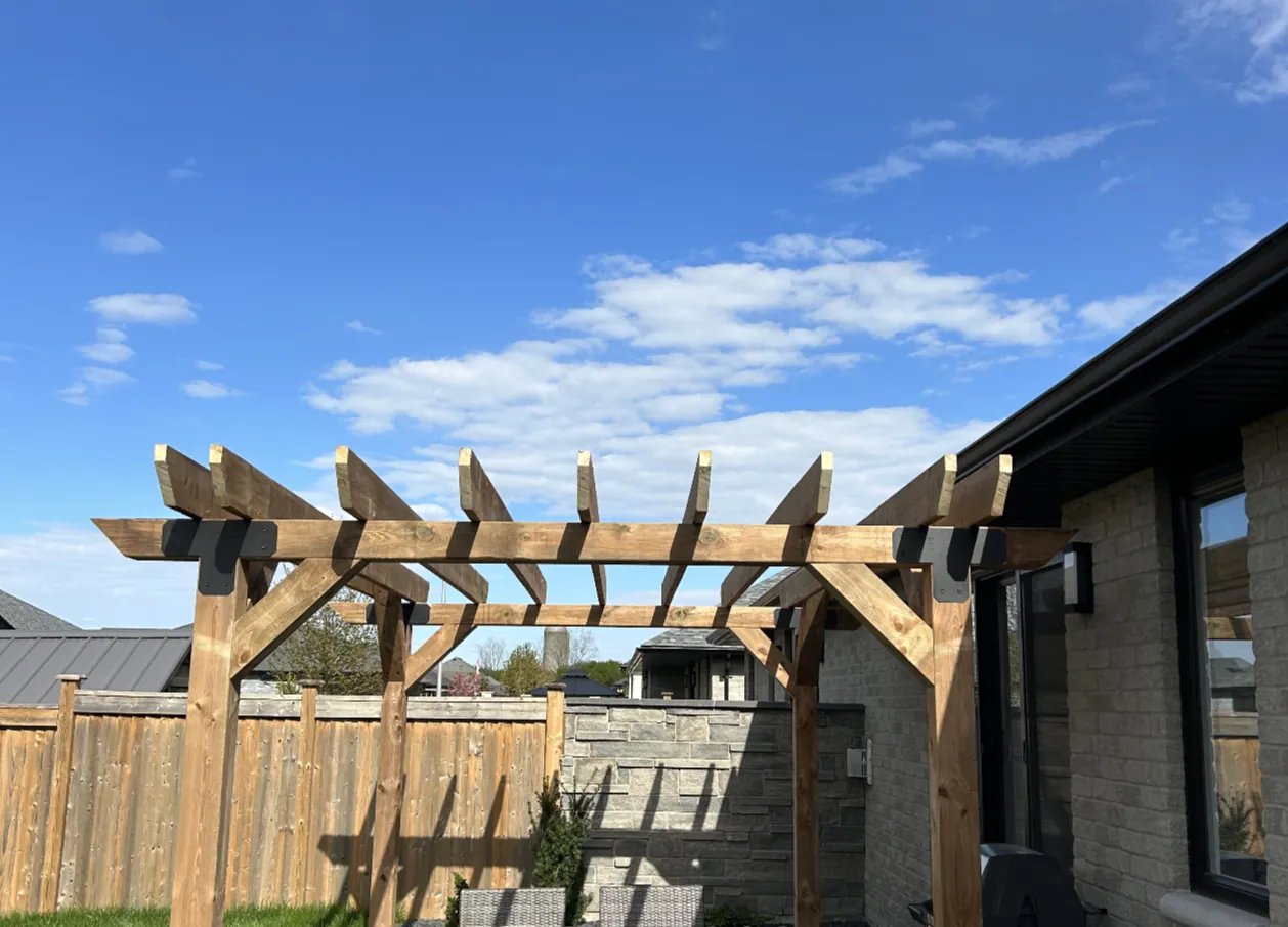 The Premium Pergola front angle showing the full pergola frame and rafters